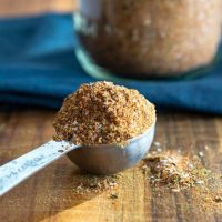 A loaded tablespoon of blended herbs and spices that make up an amazing Creole Seasoning blend.