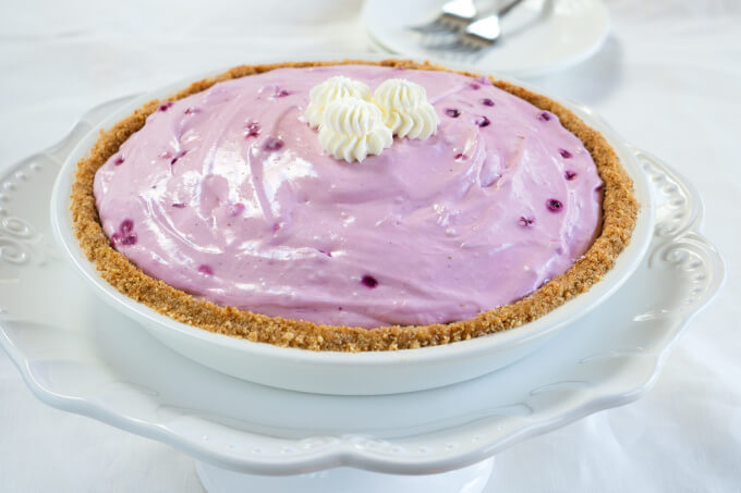 A whole Blueberry Lemonade pie sitting in a nilla crust is sweet, creamy and delicious.