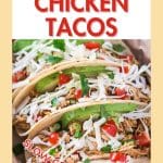 An image for Pinterest of three shredded chicken tacos.
