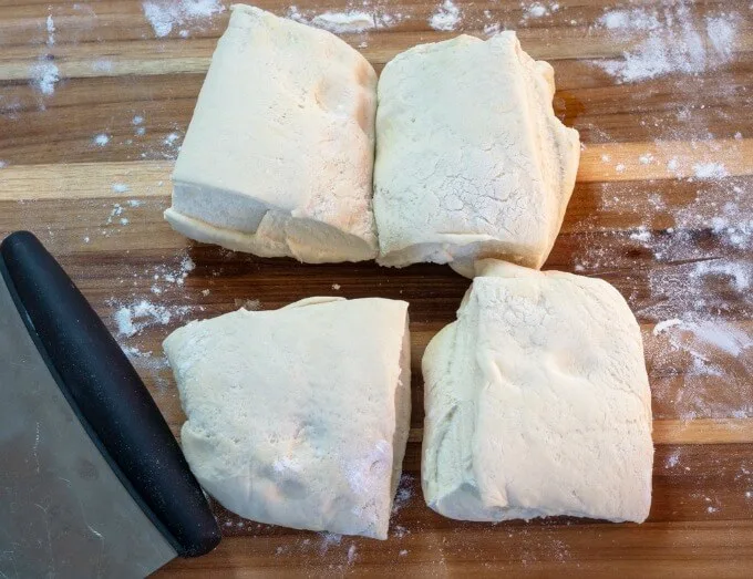 Ciabatta bread dough rolled flat and both ends folded to the center.