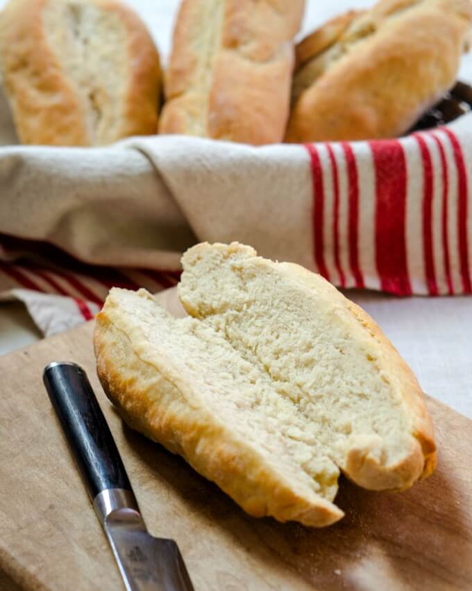 A Ciabatta roll sliced down the center shows a soft tender crumb