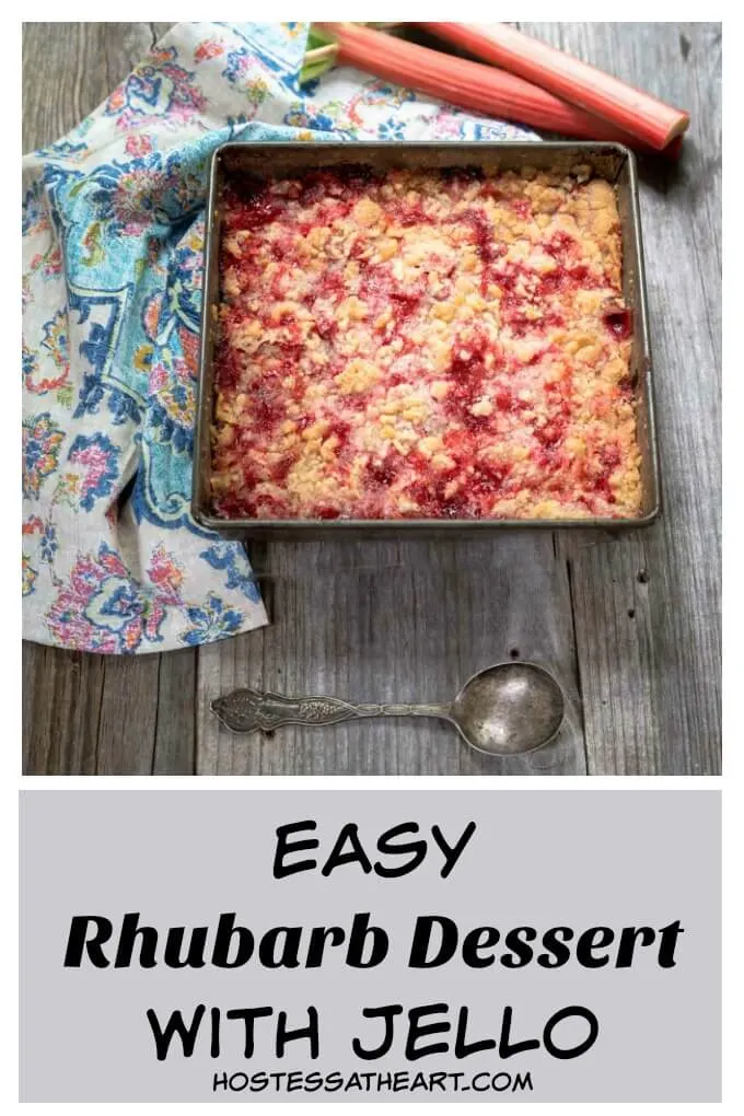 Pan of rhubarb dessert recipe with two pieces of raw rhubarb and a multi-colored napkin sit in the background over a wooden backdrop. The title \"Easy Rhubarb Dessert with Jello\" appears at the bottom of the photo.