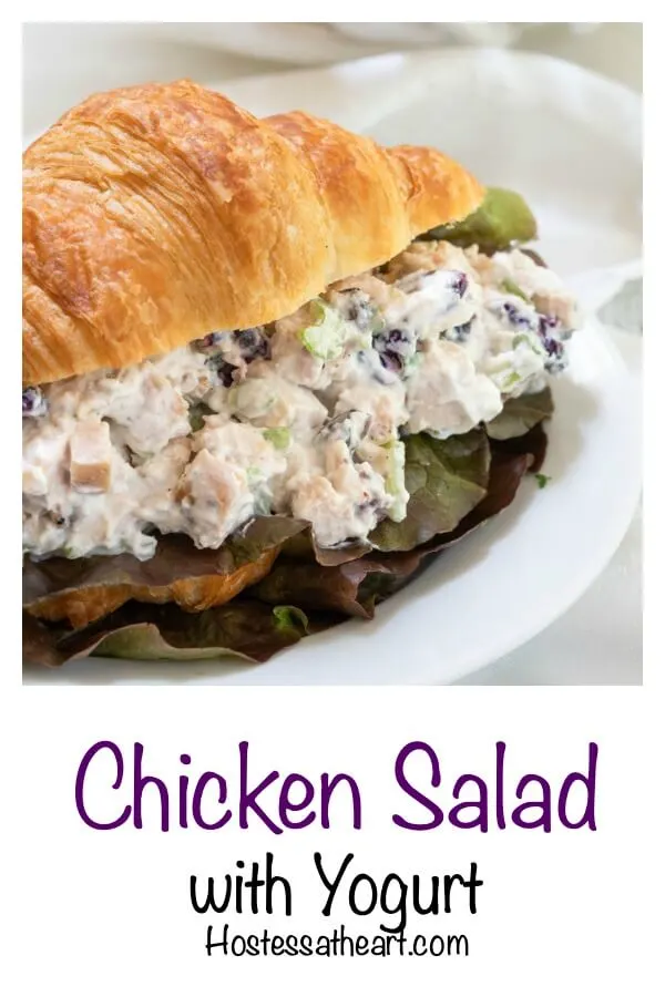 Croissant sandwich stuffed with chicken salad loaded with craisins, celery and green onion