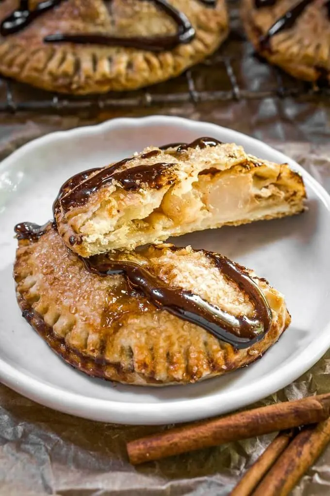 Baked round pie crust filled with diced pears and drizzled with dark chocolate