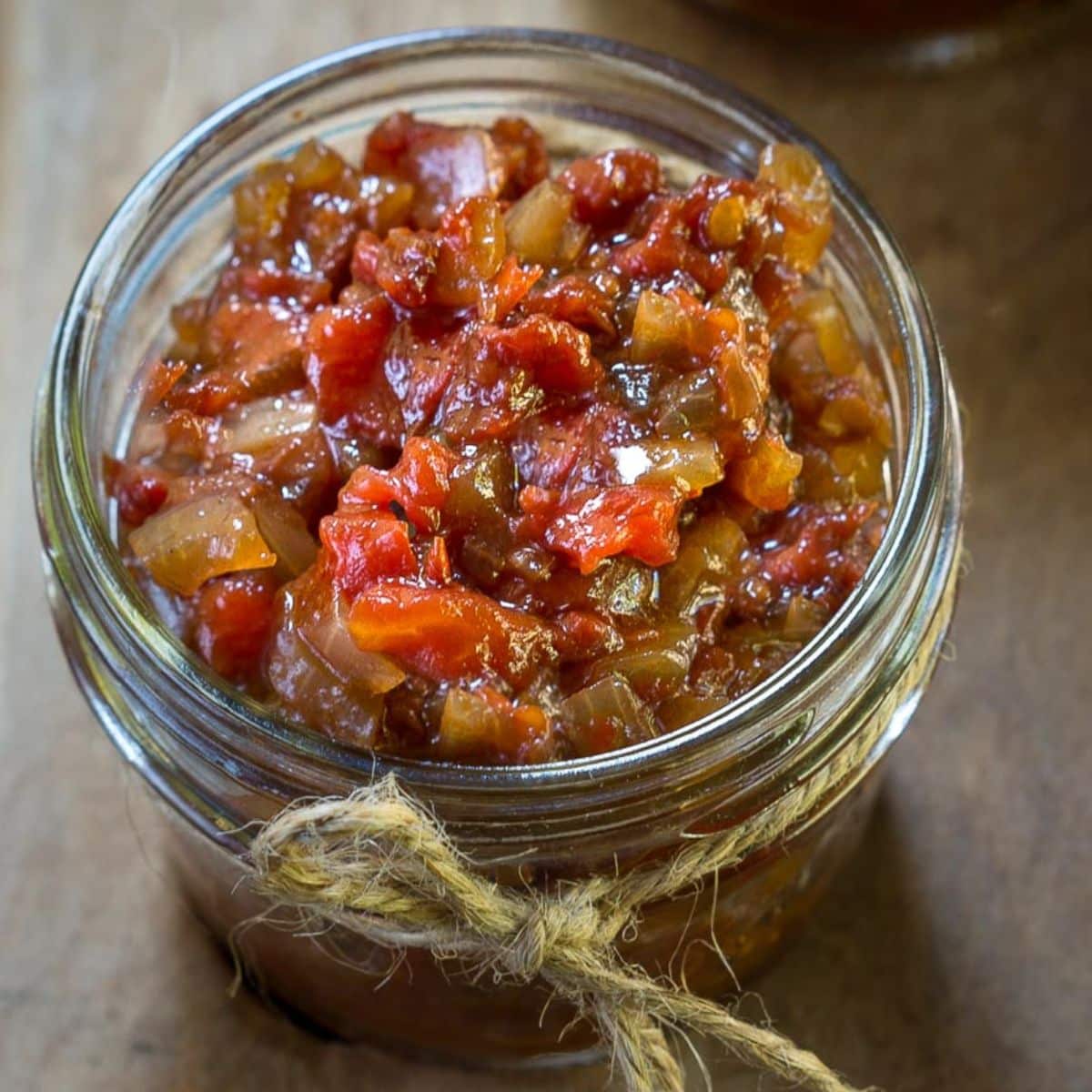top down view of a small jar filled with tomato chutney - Hostess At Heart