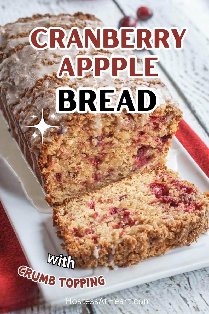 Front view of a loaf of sliced cranberry bread topped with streusel and glazed.