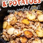 A cast iron skillet filled with fried potatoes with onions and ground Italian sausage. Hostess At Heart