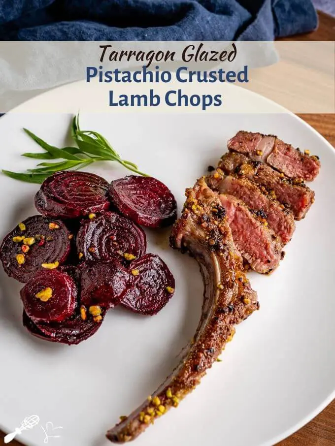 A white plate showing a pan-fried pistachio-crusted lamb chop next to a serving of sliced red beets sprinkled with pistachios. A sprig of tarragon is on the plate. The title banner \"Tarragon Glazed Pistachio Crusted Lamb Chops: runs across the top of the photo.