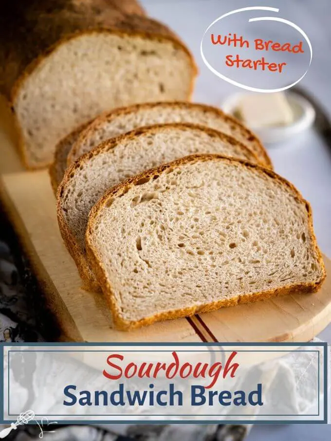 A sliced loaf of Sourdough Sandwich bread on a cutting board with the title \"Sourdough Sandwich Bread\" running through the bottom.