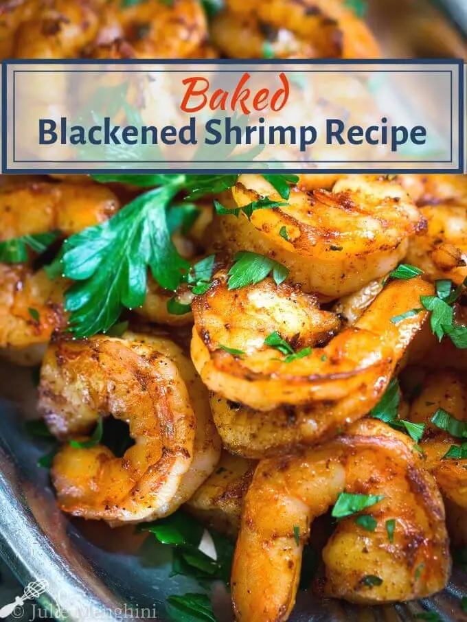Close up of spicy red plump shrimp on a silver platter garnished with fresh green parsley. The title \"Baked Blackened Shrimp Recipe appears at the top.