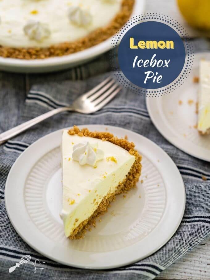Slice of Lemon Icebox pie with a creamy lemon filling over a thick graham cracker crust on a white plate sitting over a blue striped napkin. A fork, a partial second piece of pie and the pie is in the background. The title "Lemon Icebox Pie Recipe" is in the upper right hand corner.