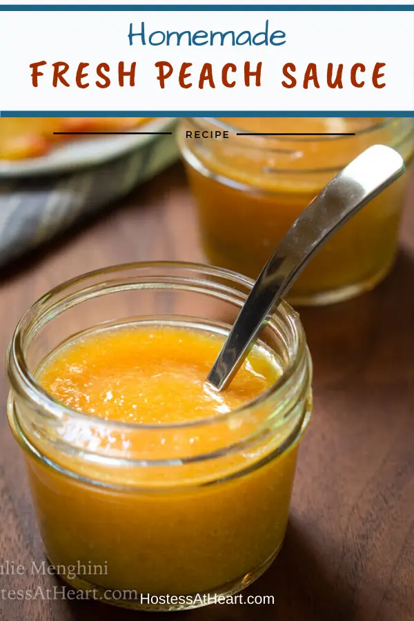 A jar of peach sauce with a spoon sitting in it over a wooden board. A second jar sits in the background. The title "Homemade Fresh Peach Sauce runs across the top.