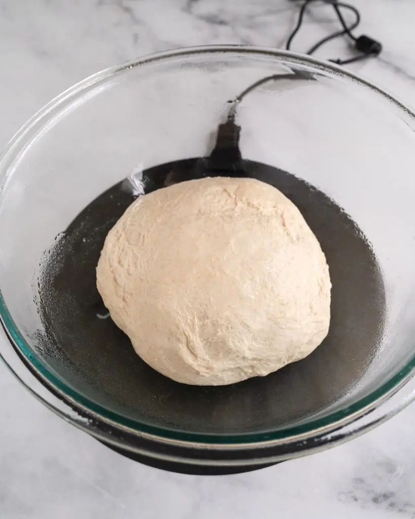 Bowl filled with bread dough sitting on a Raisenne Dough Proofer