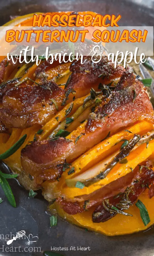 Butternut squash sliced and baked with apple, bacon, and rosemary on a metal plate.