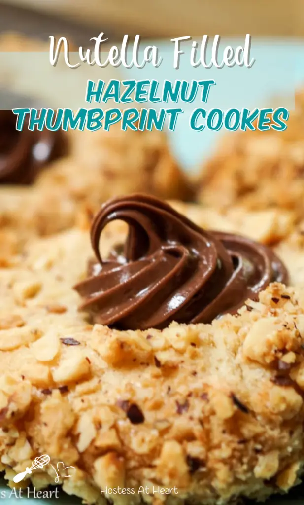 Close-up sideview photo of a Nutella Filled Hazelnut Thumbprint cookie.