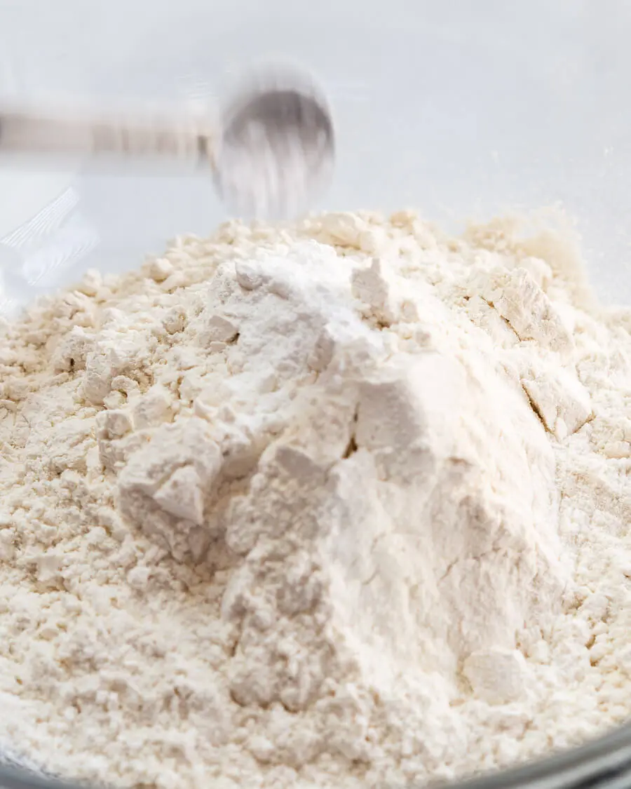 A bowl full of the dry ingredients in vanilla muffins.