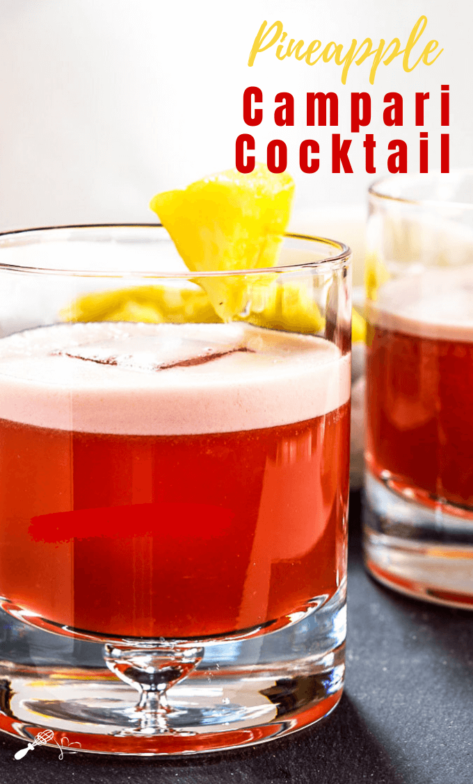 Sideview of two rocks glasses filled with a Campari Drink and garnished with pineapple.