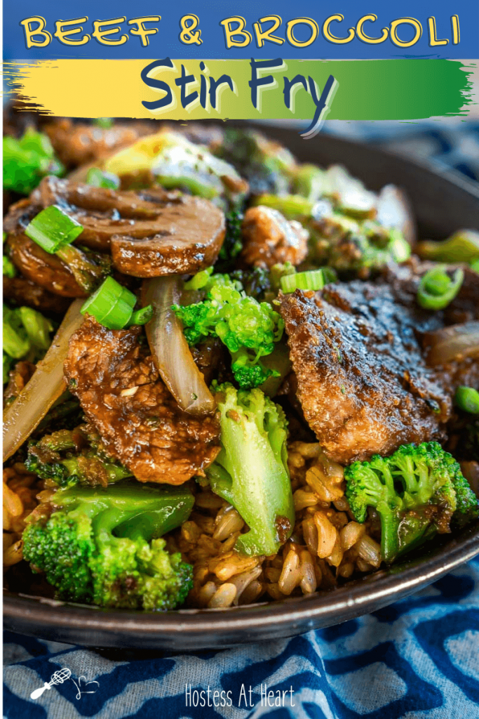 Side view of a black bowl filled with Beef and Broccoli Stir Fry over brown rice. The recipe title runs across the top for Pinterest.