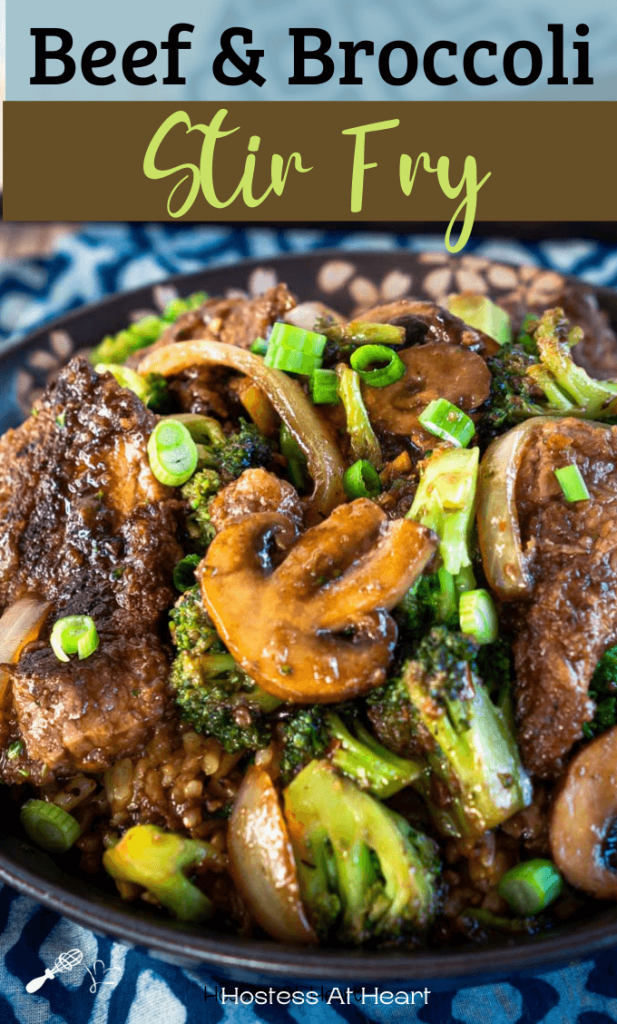 Side view of a black bowl filled with Beef and Broccoli Stir Fry over brown rice. The recipe title runs across the top for Pinterest.