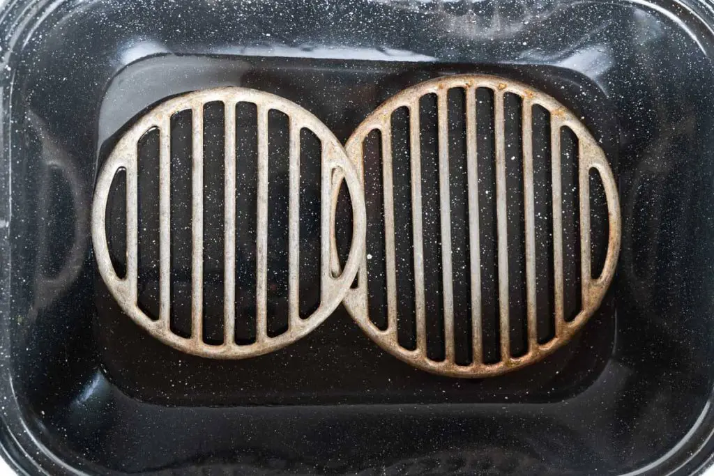 Grates sitting in the bottom of a roasting pan