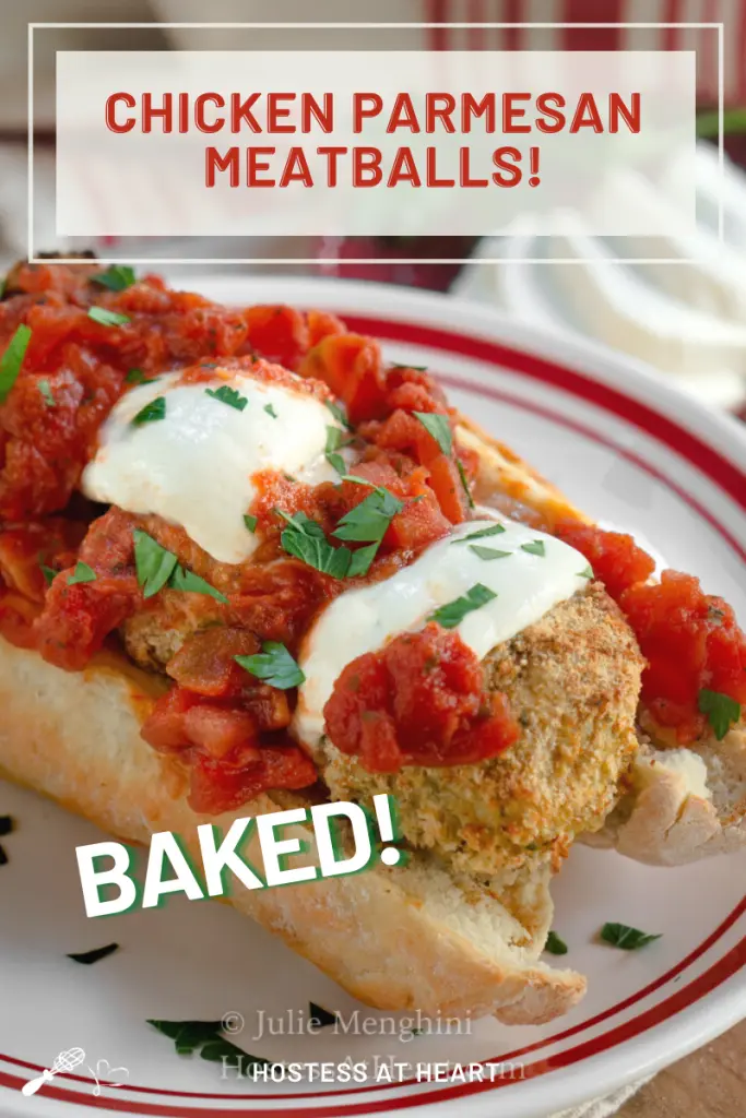 A sub sandwich filled with meatballs topped with tomato sauce, baked mozzarella and chopped parsley.