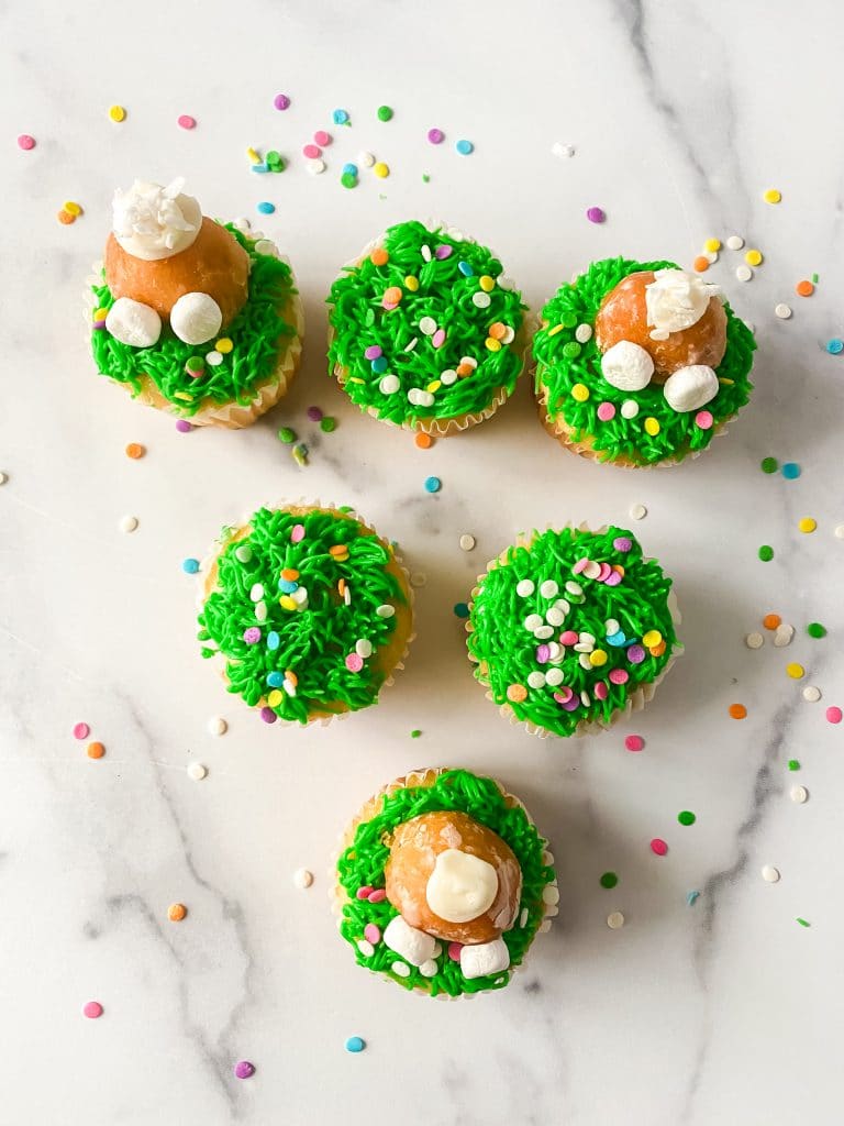 Bunny Butt Cupcakes with Garden Cupcakes on display.