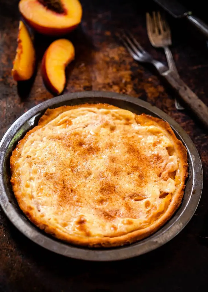 Top down photo of a Fresh Peach Dessert in a pie tin.