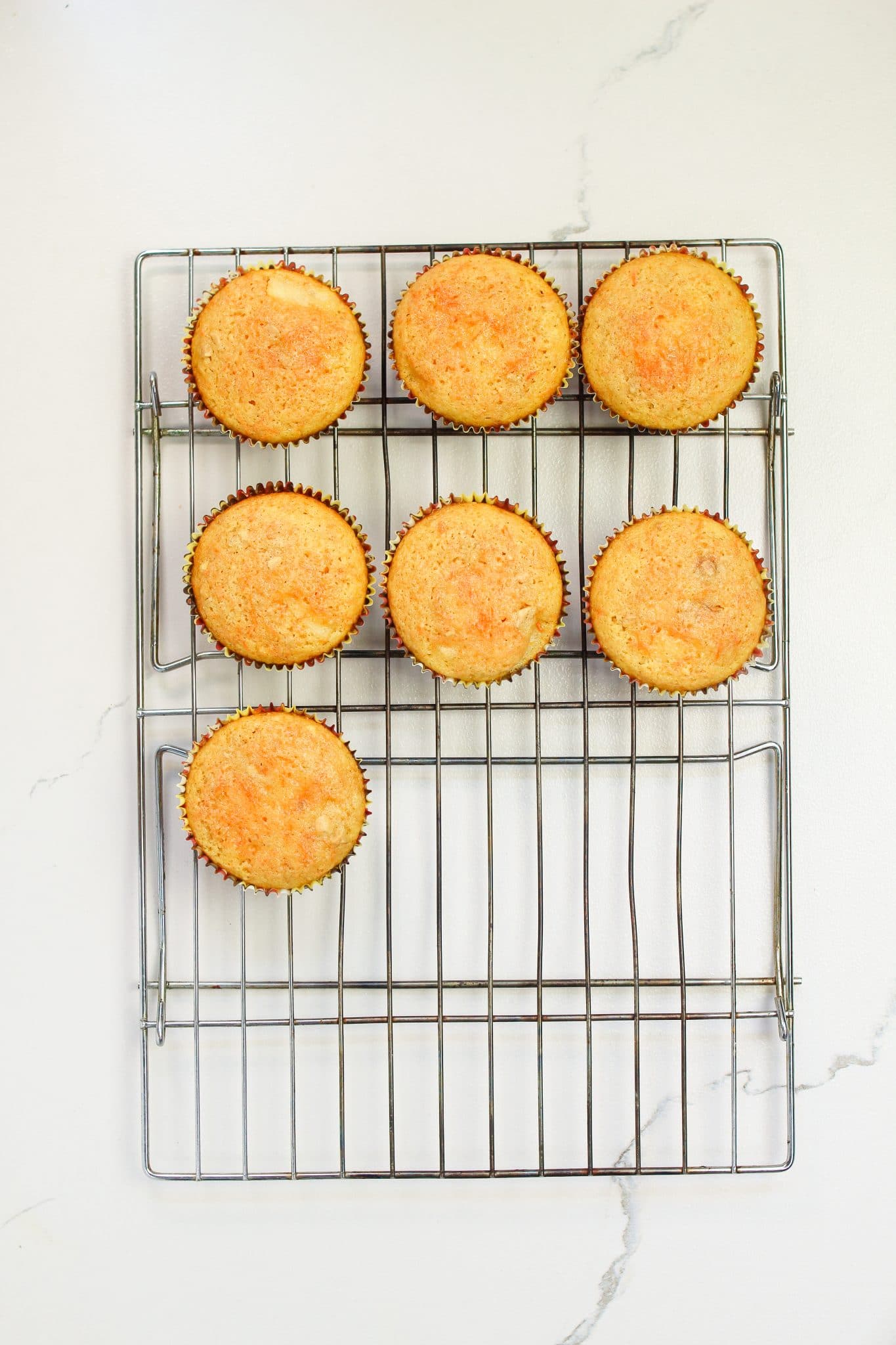 cupcakes cooling on a rack.
