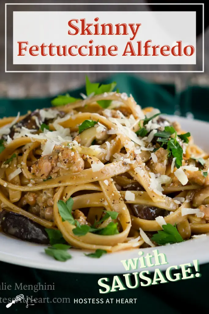 Close-up of a plate filled with Fettuccine with Sausage garnished with cheese and parsley.