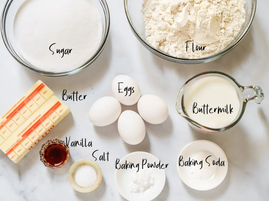 Ingredients used to make a Kentucky Butter Cake including butter, vanilla, salt, baking powder, baking soda, buttermilk, eggs, sugar and flour