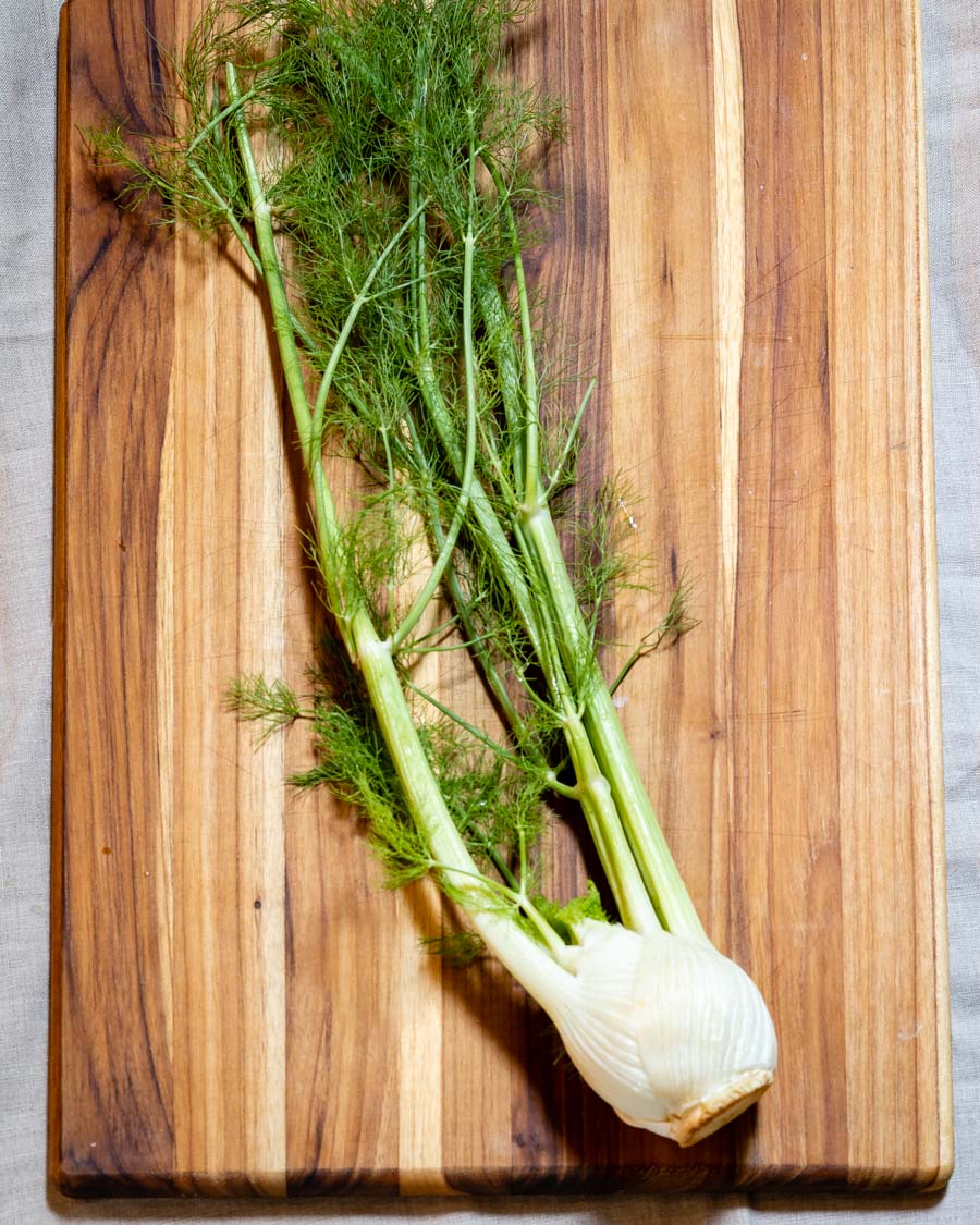 fennel on a cutting board, ready to be chopped.
