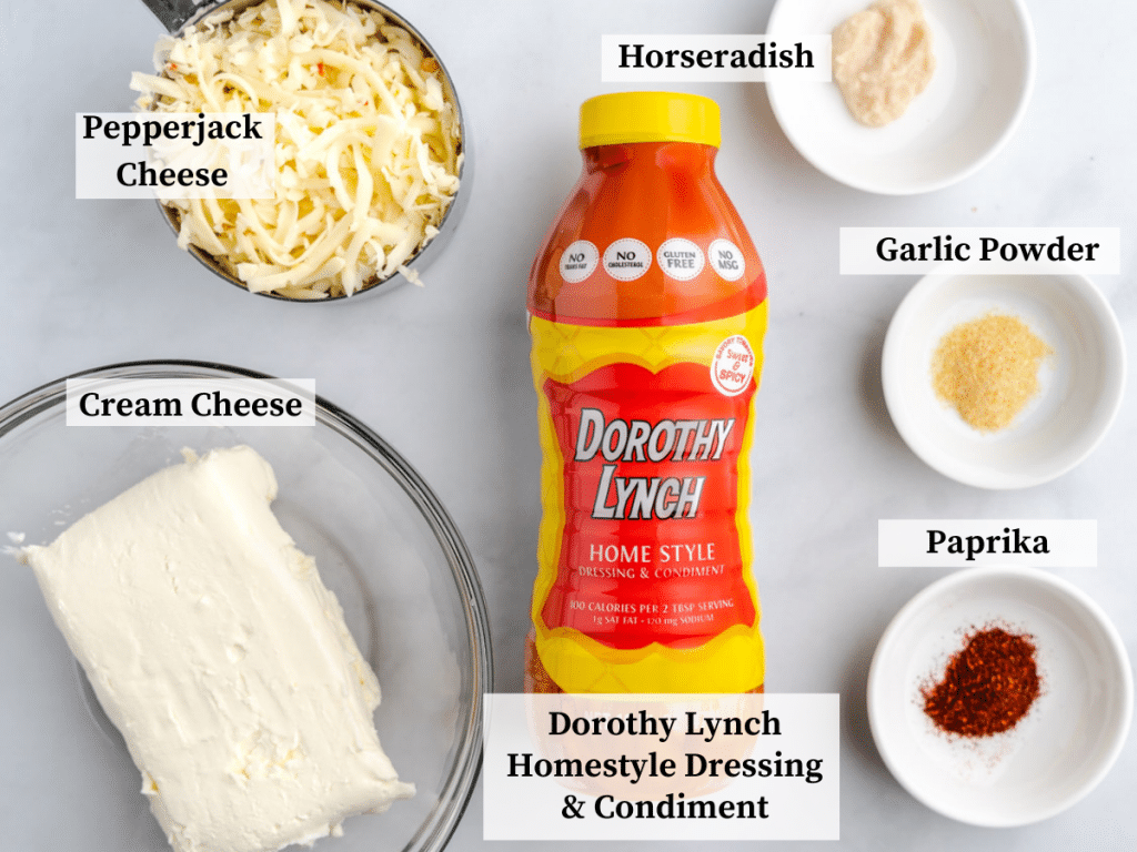 Ingredients in our football cheeseball recipe including cream cheese, Dorothy Lynch Homestyle Dressing & Condiment, Paprika, Garlic Powder, Horseradish cream, and Pepperjack cheese.