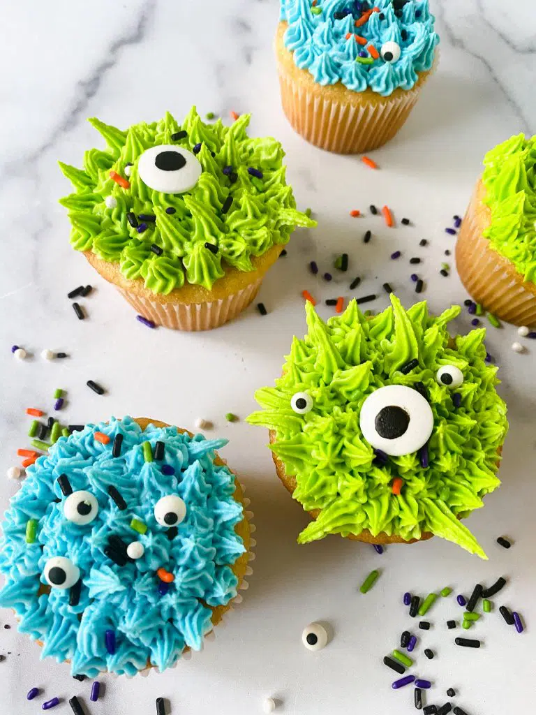 Super cute monster cupcakes with eyes.