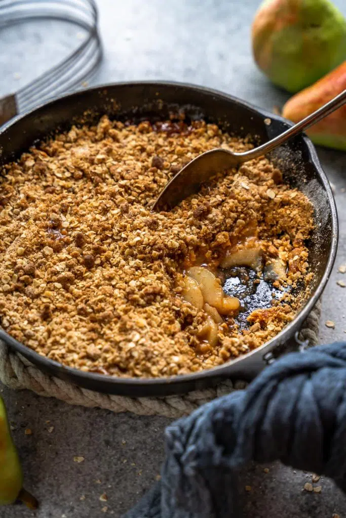 Pear crisp in a cast iron skillet.