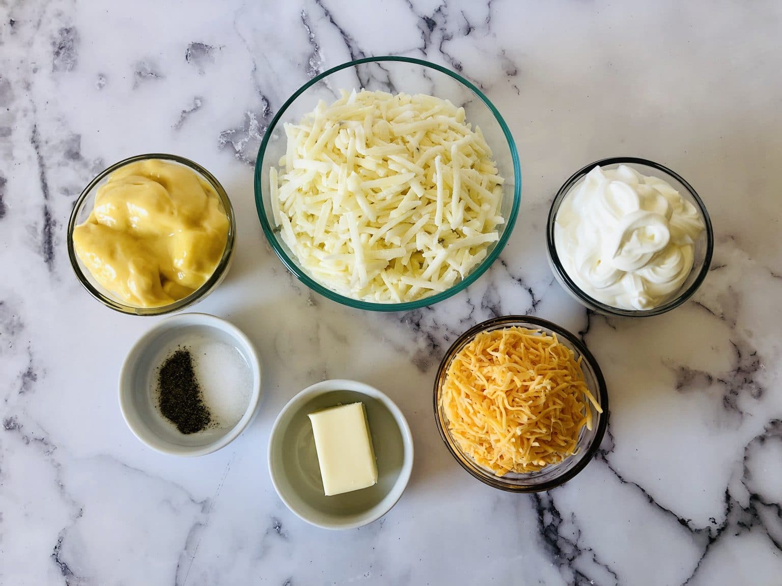 Ingredients: Cheese, cream of chicken soup, sour cream, butter, shredded potatoes, salt and pepper.