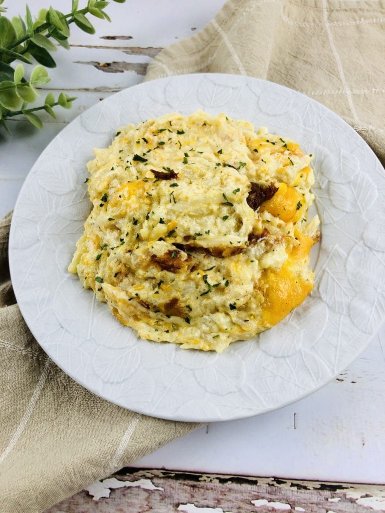 Cheesy potatoes on a plate.