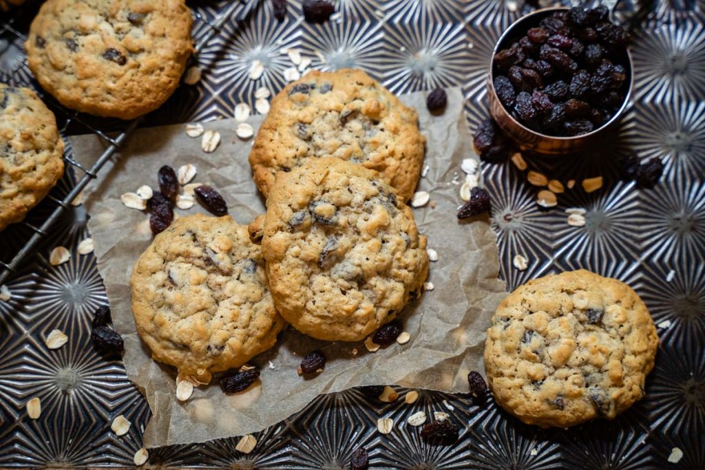 Several of the best oatmeal raisin cookies on a countertop. 