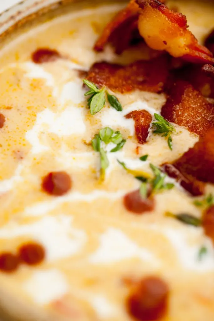 Close-up of the beer cheese soup recipe with crispy bacon.