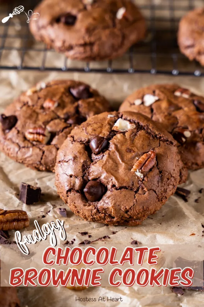 Close up of chocolate brownie cookies dotted with chocolate chops and nuts.