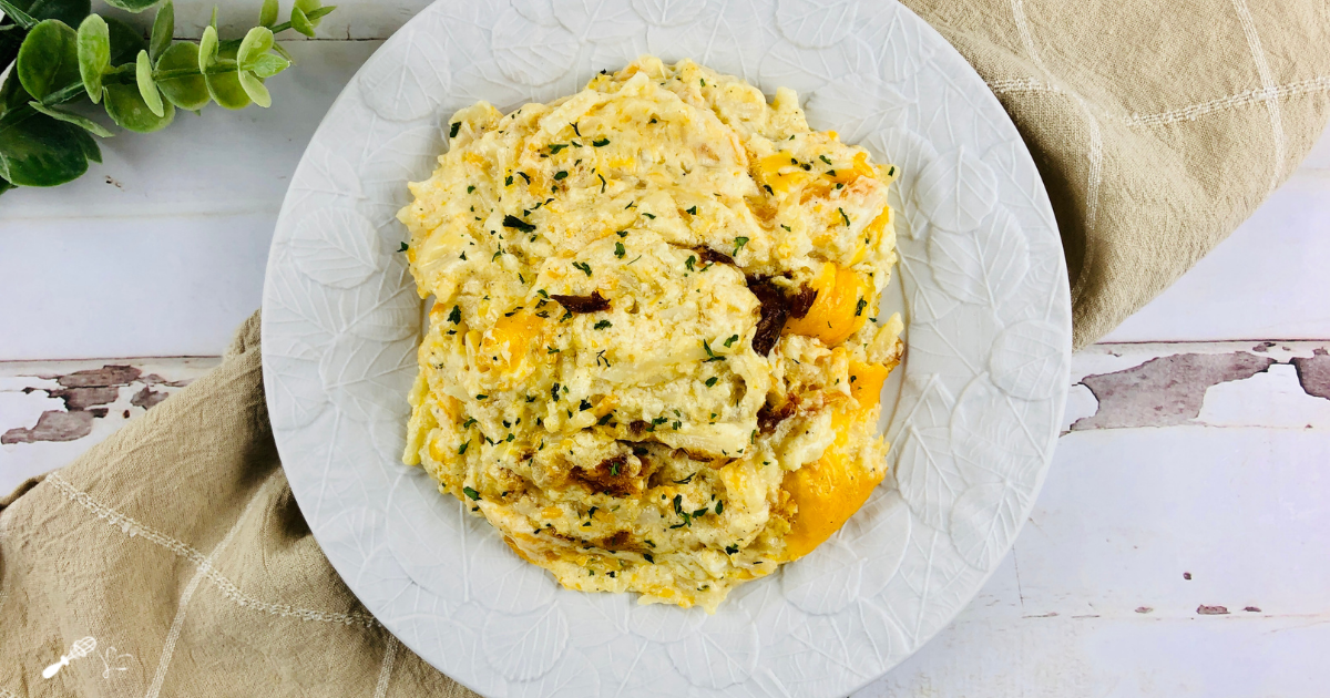 Top down view of hash brown casserole on a plate.