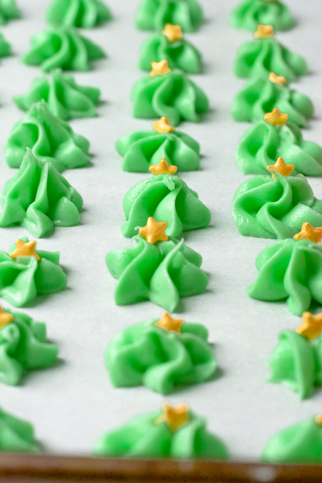 Cream cheese mints on parchment paper.