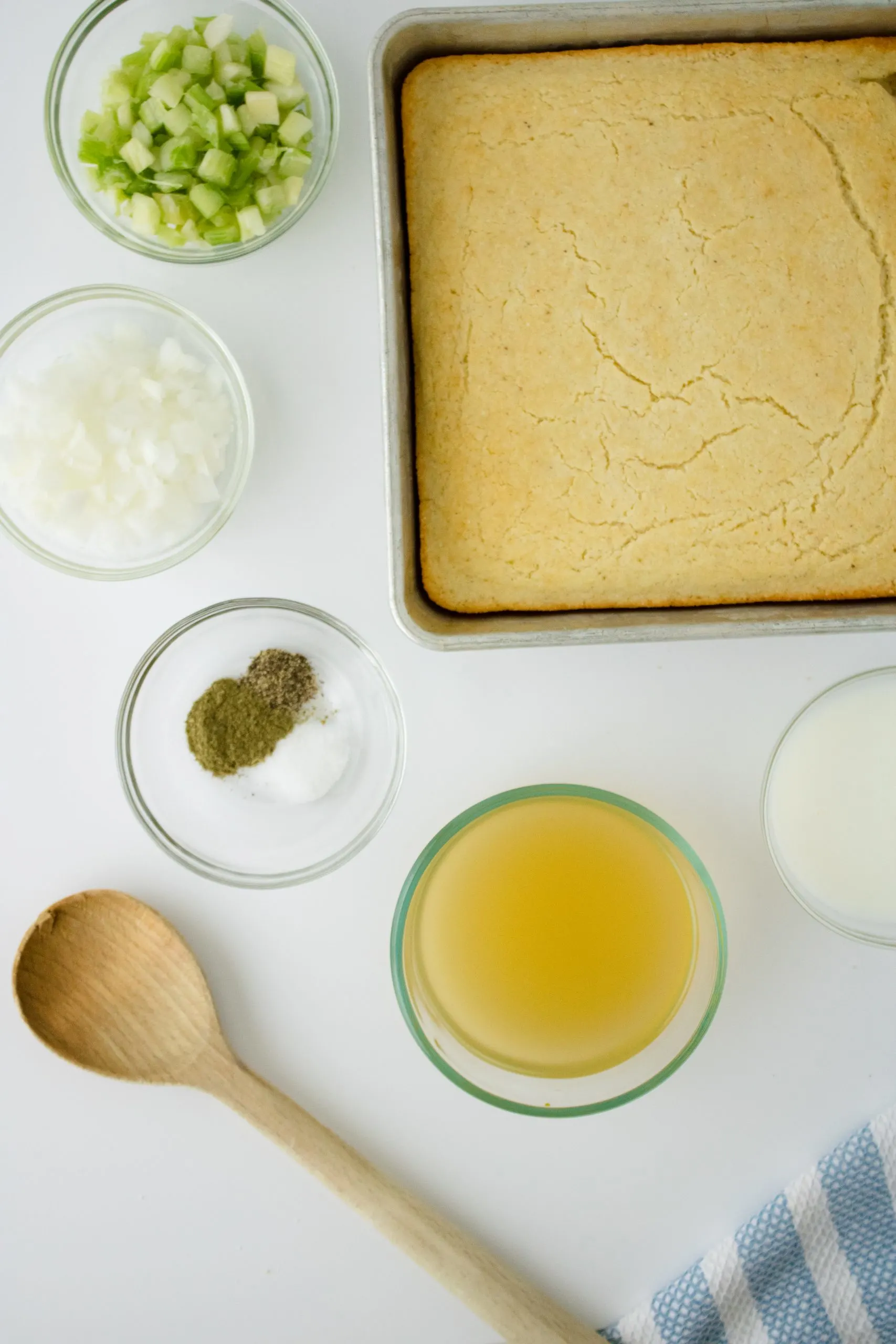 Ingredients: celery, onions, sage, poultry seasoning, salt, pepper, chicken broth, buttermilk, cornbread, spoon.