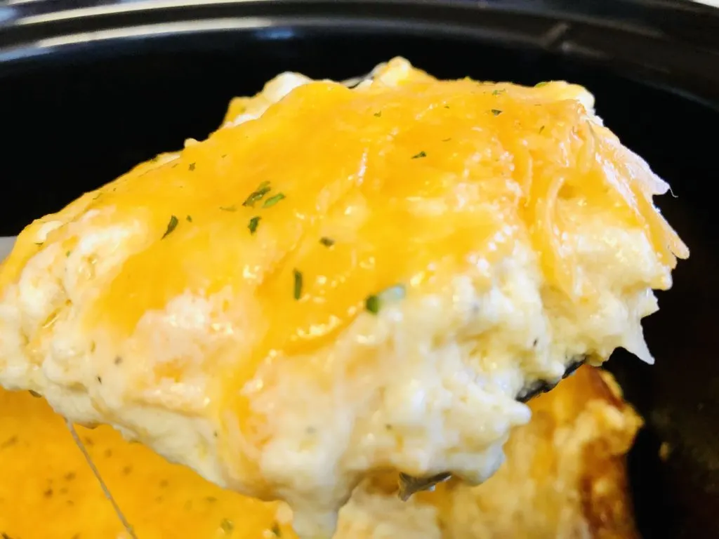 A spoonful of cheesy hashbrown casserole