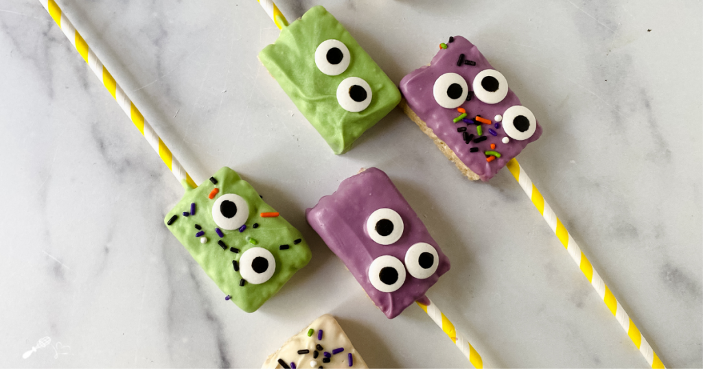 Rice Krispie cookies dipped in candy coating and topped with sprinkles and candy eyes.