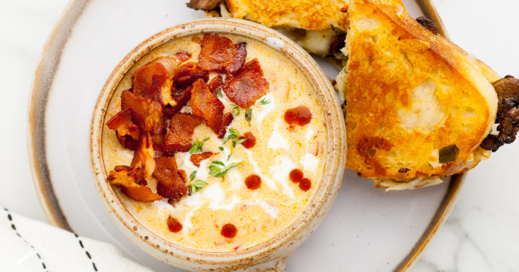 Top down view of a bowl of beer cheese soup