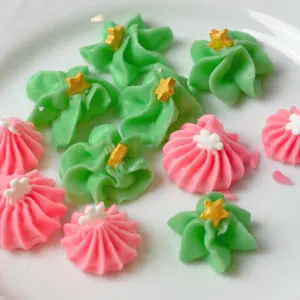 Green and pink cream cheese mints on a plate
