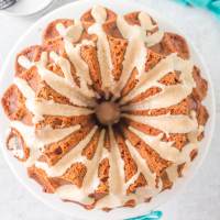 Top down view of a bundt cake drizzled with glaze.