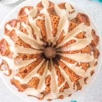 Top down view of a bundt cake drizzled with glaze.
