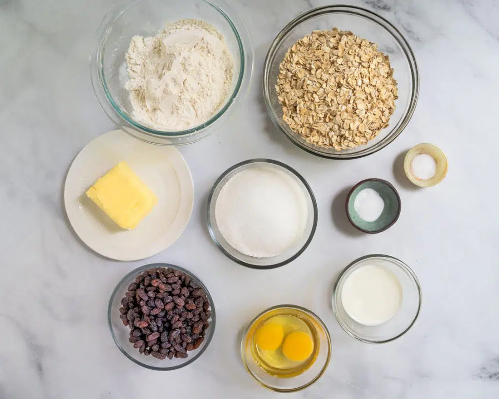 Easy Oatmeal Raisin Cookie recipe ingredients including: eggs, raisins, shortening, flour, sugar, salt, old-fashioned oats, and milk - Hostess At Heart