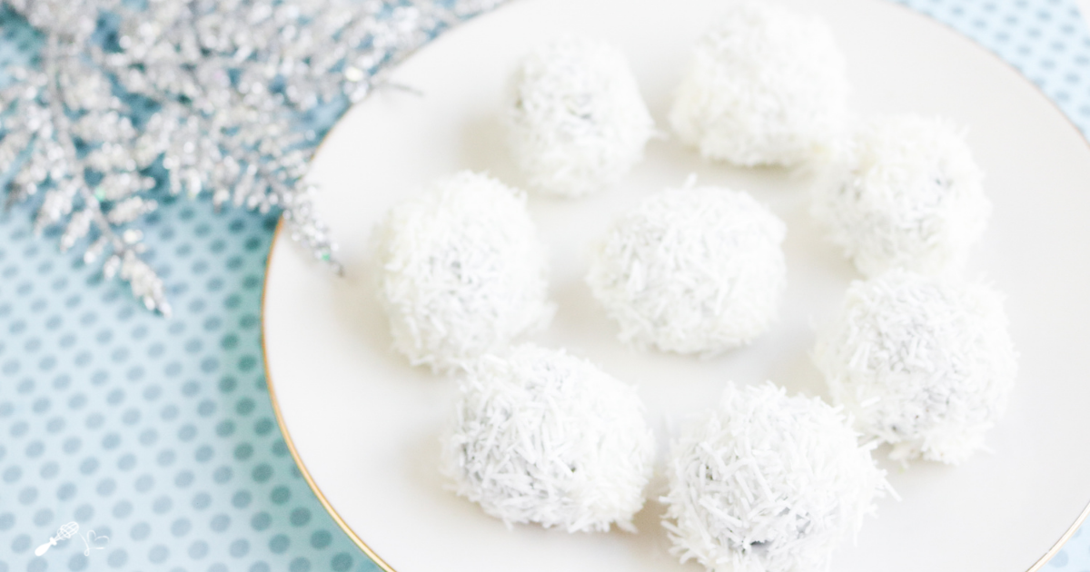 Top down view of White Chocolate Oreo Cookie snowballs on a plate.